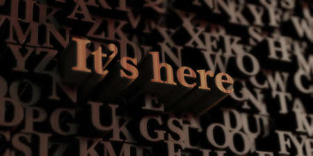 It?s Here - Wooden 3D rendered letters/message.  Can be used for an online banner ad or a print postcard.の写真素材
