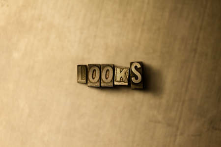 LOOKS - close-up of grungy vintage typeset word on metal backdrop. Royalty free stock illustration.  Can be used for online banner ads and direct mail.の写真素材