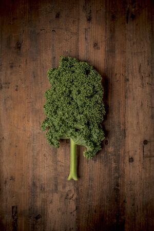 Kale vegetable on a rustic wood backgroundの写真素材