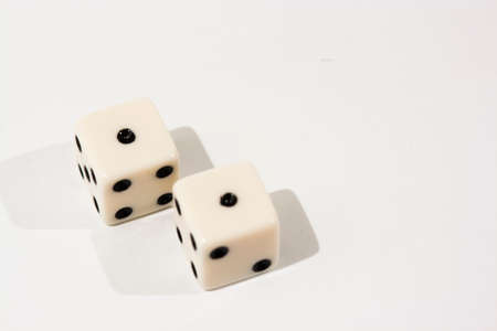 White dice shot against a white backgroundの写真素材