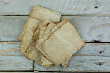 Piece of old paper on wooden planksの写真素材