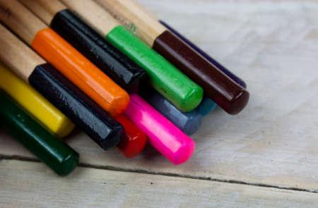 Close f of coloured pencils against a wooden backgroundの写真素材