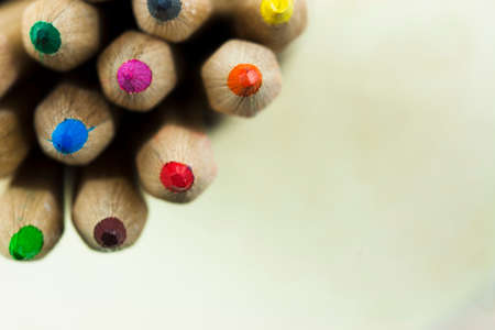Close f of coloured pencils against a wooden backgroundの写真素材