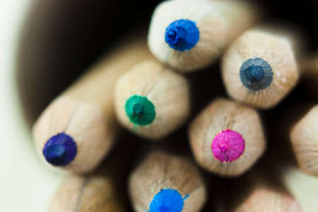 Close f of coloured pencils against a wooden backgroundの写真素材