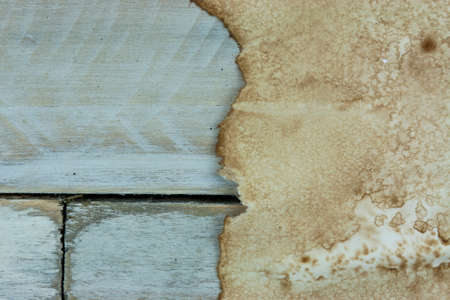 Piece of old paper on wooden planksの写真素材