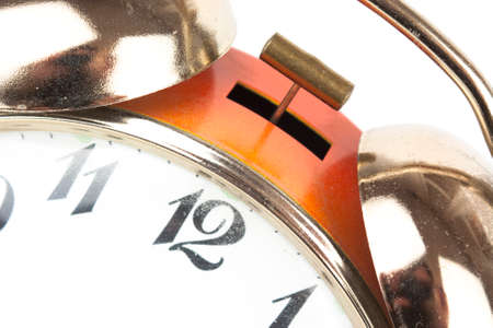 Close up of an alarm clock on a white backgroundの写真素材