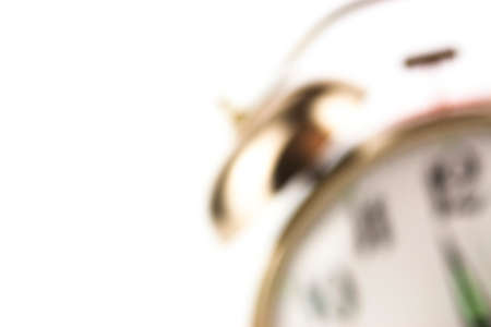 Close up of an alarm clock on a white background - blurredの写真素材