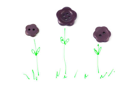 Close up of various purple button scattered on a white surface.
