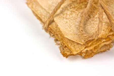 Bundle of old paper wrapped up and tided with stringの写真素材