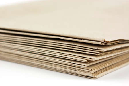 Stack of folded up brown parcel paperの写真素材