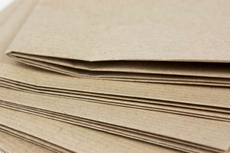 Stack of folded up brown parcel paperの写真素材