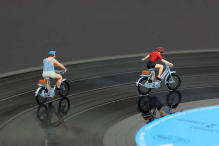 Model people having a cycle race on a record