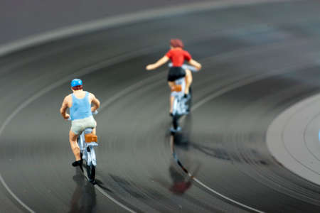 Model people having a cycle race on a recordの写真素材