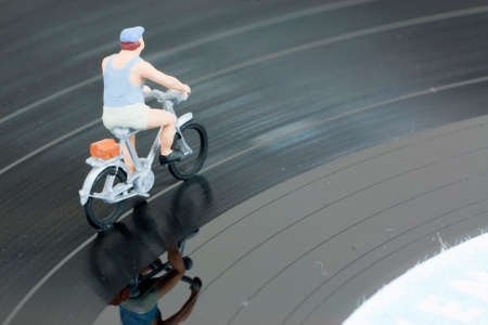 Model people having a cycle race on a recordの写真素材