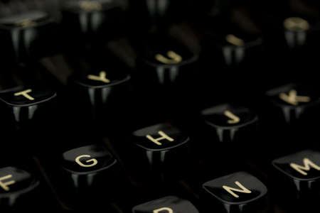 Close up of lettered keys on an old typewriter. Shallow depth of field.の写真素材