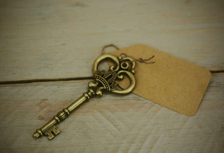 Close up of old vintage keys on a rustic background. Vintage filter applied.の写真素材
