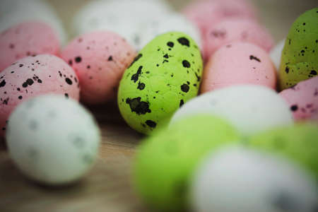Close up of Easter eggs on a wooden background. Vintage filter applied.