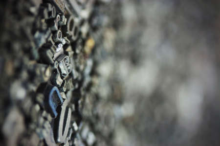 Close up of old used metal typeset letters. Vintage filter applied.の写真素材