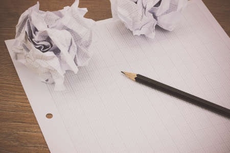 Calculator and drawing equipment and graph paper on a table. Retro filter applied.の写真素材