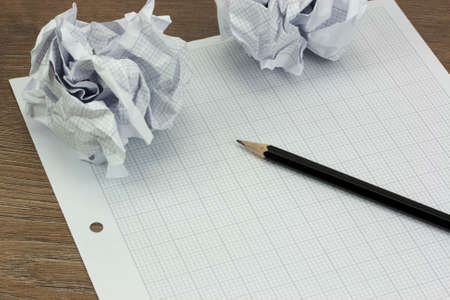 Calculator and drawing equipment and graph paper on a table