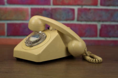 Old well used retro style rotary telephoneの写真素材