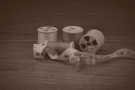 Close up of various bit of sewing equipment. Black and white filter applied.