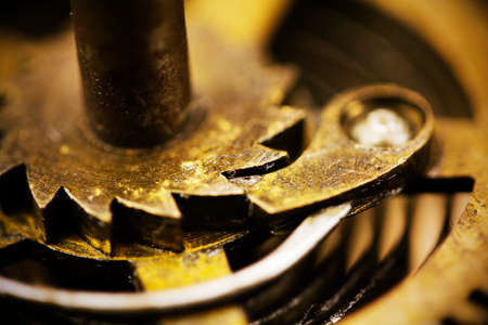 Close up of cogs from the inside of a clock. Retro filter applied.