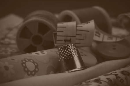 Close up of various bit of sewing equipment. Black and white filter applied.の写真素材