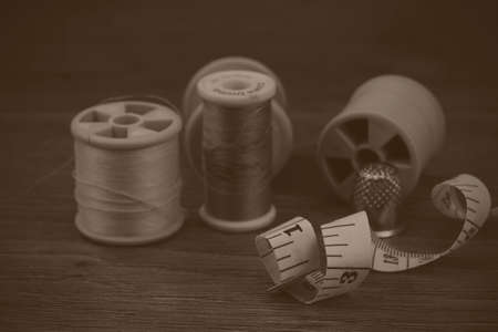 Close up of various bit of sewing equipment. Black and white filter applied.の写真素材