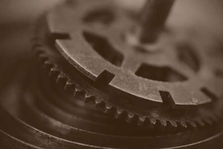 Close up of cogs from the inside of a clock. Black and white filter applied.の写真素材