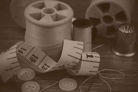 Close up of various bit of sewing equipment. Black and white filter applied.の写真素材