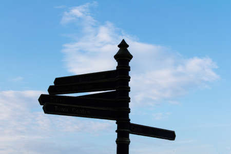 Tourist information signpost against a blue skyの写真素材