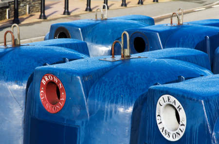 Blue recycling bins for different coloured glassの写真素材