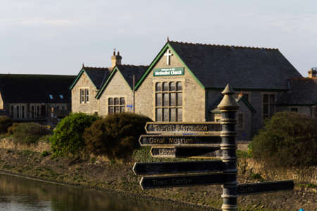 Tourist information sign with church in backgroundの写真素材