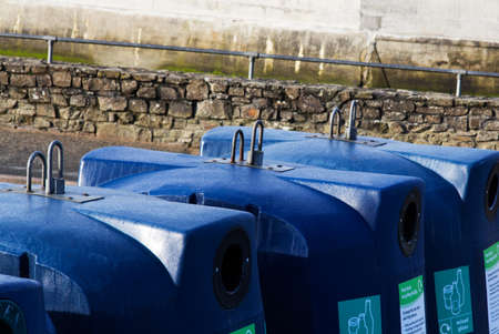Blue recycling bins for different coloured glassの写真素材