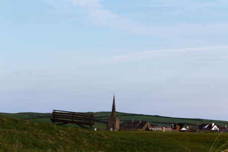 View of a church in Bude from the golf courseの写真素材