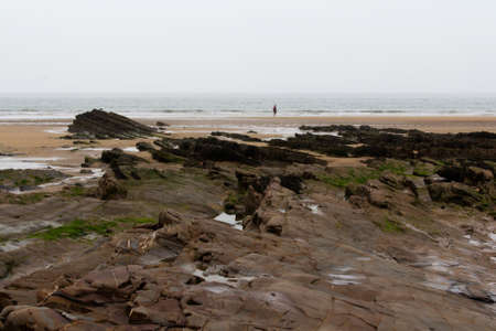 Rocks on the shore in Bude, Cornwallの写真素材