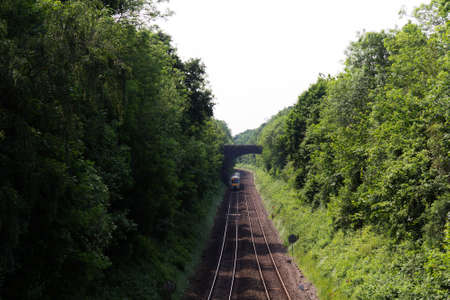 View over the railway line with trees on each side