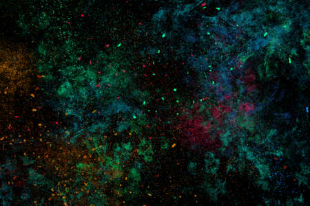 Colourful abstract powder explosion on a black backgroundの写真素材