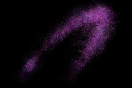 Colourful abstract powder explosion on a black backgroundの写真素材