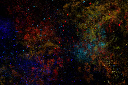 Colourful abstract powder explosion on a black background