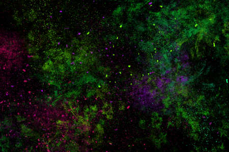 Colourful abstract powder explosion on a black background