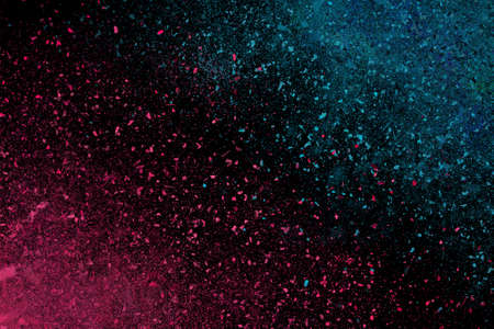 Colourful abstract powder explosion on a black backgroundの写真素材