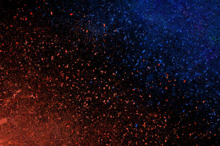 Colourful abstract powder explosion on a black backgroundの写真素材