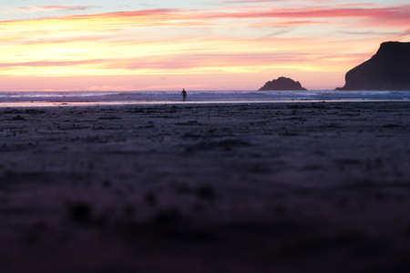 Colourful sunset over the beach at Polzeath, Cornwall