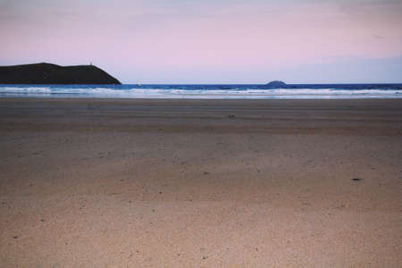 Early morning view over the beach at Polzeath, Cornwall Vintage Retro Filter.