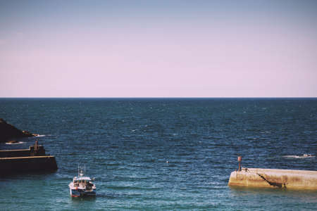 View of the harbour at Port Issac, Cornwall Vintage Retro Filter.のeditorial素材