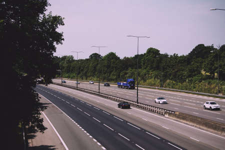 BEACONSFIELD, ENGLAND - JUNE 2016: Busy M40 motorway at the Beaconsfield turn off  Vintage Retro Filter.のeditorial素材