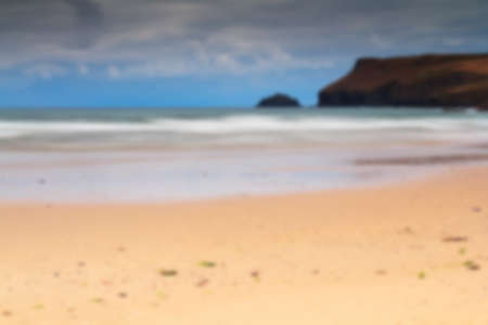Early morning view of the beach at Polzeath, England. Long exposure. Out of focus.の写真素材