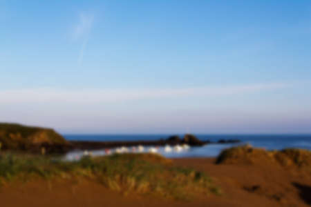 View from the sand dunes on Bude seafront Out of focus.の写真素材